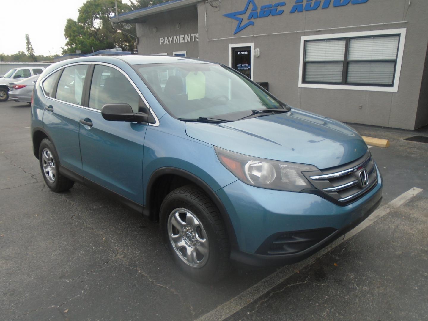 2014 Honda CR-V LX 4WD 5-Speed AT (2HKRM4H35EH) with an 2.4L L4 DOHC 16V engine, 5-Speed Automatic transmission, located at 6112 N Florida Avenue, Tampa, FL, 33604, (888) 521-5131, 27.954929, -82.459534 - Photo#2